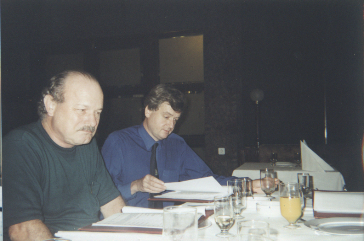 Late night party in Bucharest. Joe Haldeman and Jonathan Cowie studying the menu list